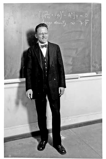 Erwin Schrödinger at a blackboard, 1926, beside his own wave equation